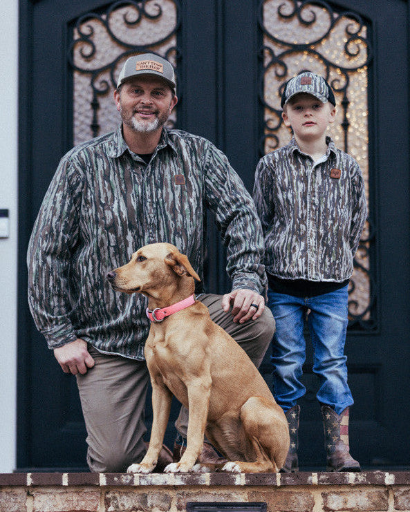 bc raskulls man-child adult twill button-up shirt michael waddell and child posing with dog