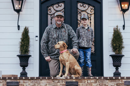 bc raskulls man-child adult twill button-up shirt michael waddell and child posing with dog